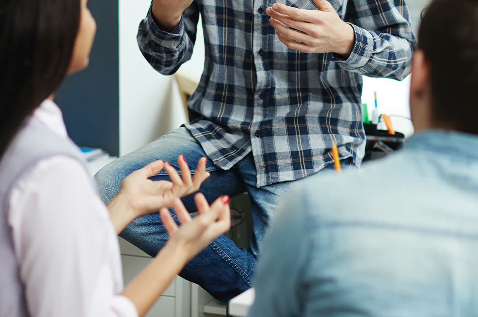 An advisor talking with a couple during a consultation